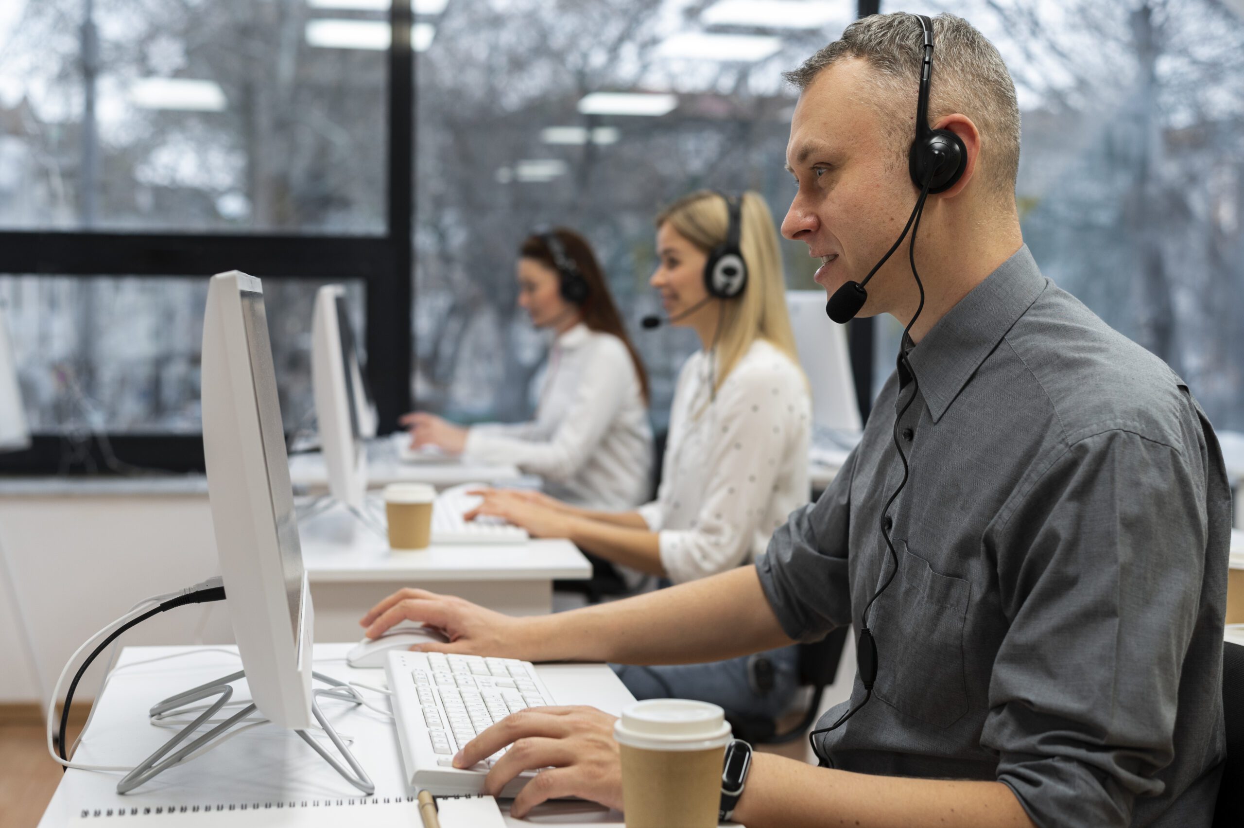 colleagues-working-together-call-center-office-with-coffee