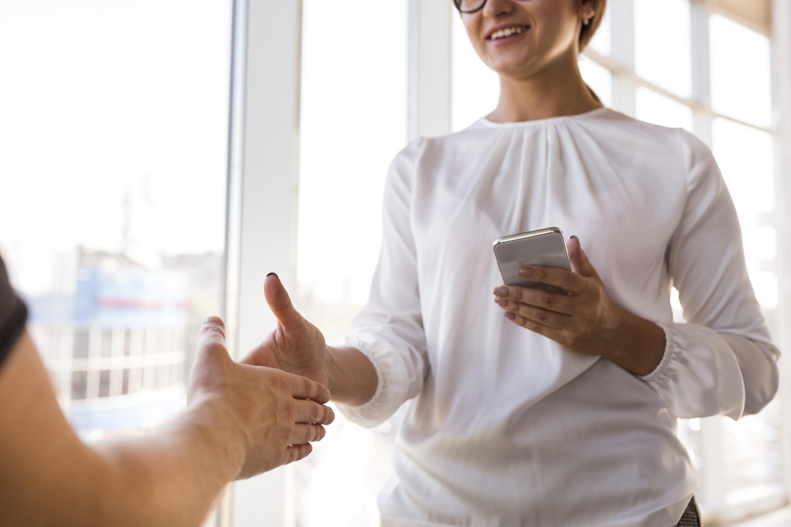 smiley-businesswoman-saluting-someone